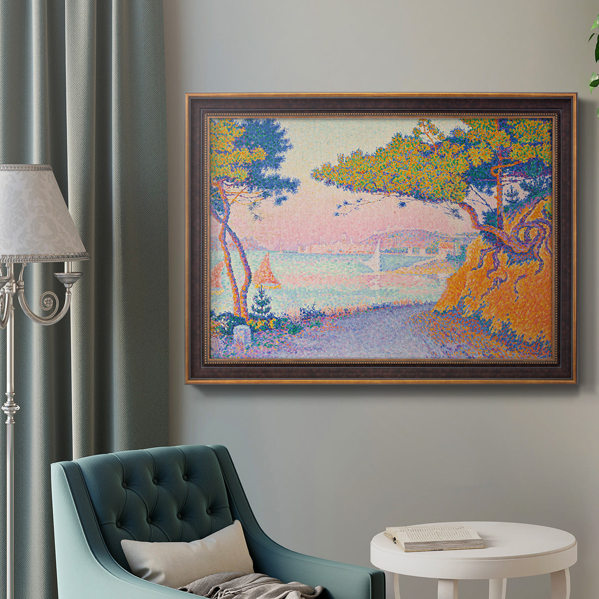 Pointillist coastal seascape by Paul Signac in an ornate bronzed mahogany wood frame displayed in a bright interior setting.