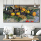Three-panel canvas wall art featuring still life with pears and grapes, displayed in a modern living room above seating.