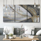 Three-panel canvas wall art featuring spiraling abstract vortex motion, displayed in a modern living room above seating.