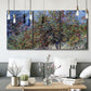 Three-panel canvas wall art featuring orchard of trees in spring bloom, displayed in a modern living room above seating.