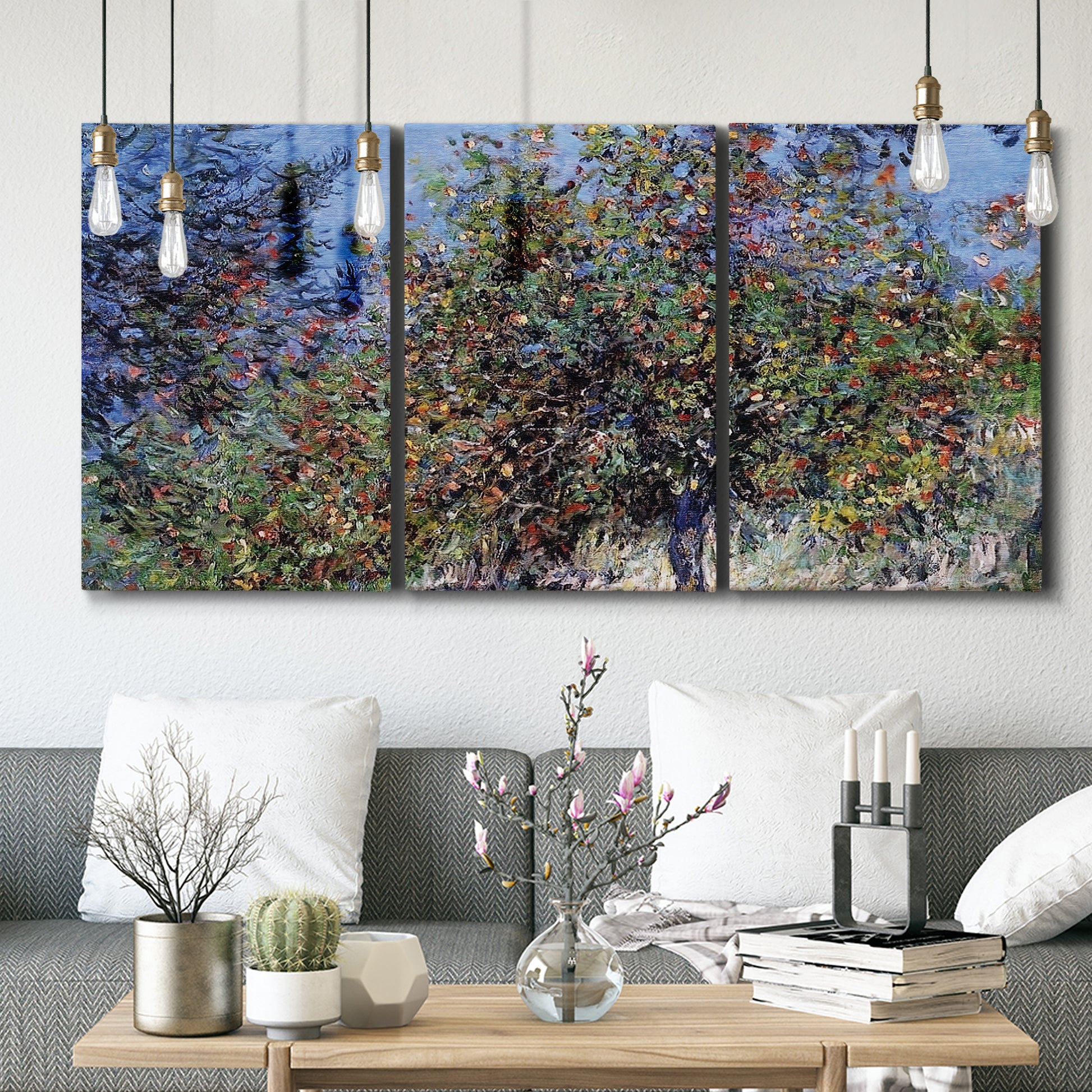 Three-panel canvas wall art featuring orchard of trees in spring bloom, displayed in a modern living room above seating.