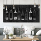 Three-panel canvas wall art featuring illustrated wine bottle cellar diagram, displayed in a modern living room above seating.