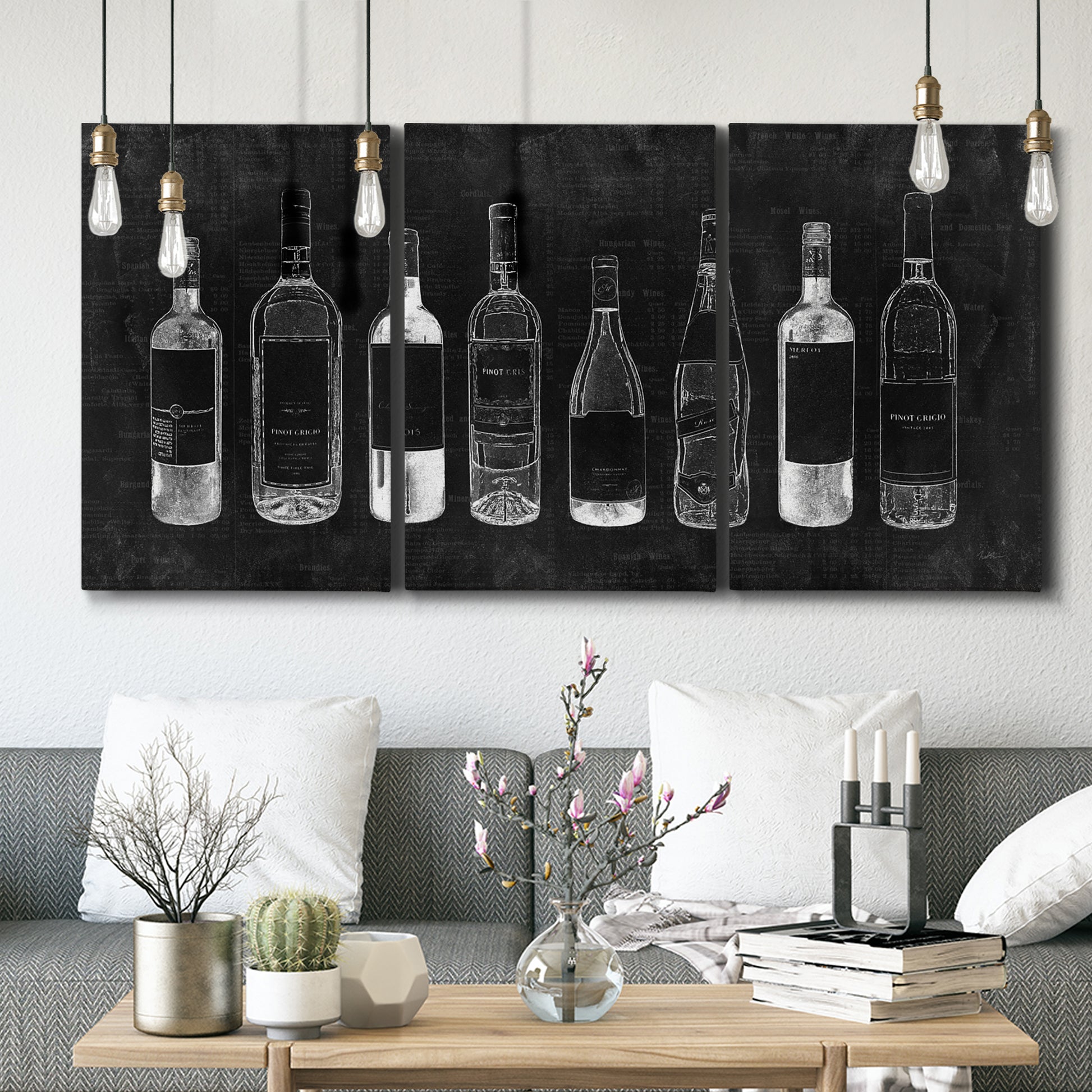 Three-panel canvas wall art featuring illustrated wine bottle cellar diagram, displayed in a modern living room above seating.