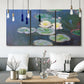 Three-panel canvas wall art featuring water lilies floating on pond, displayed in a modern living room above seating.