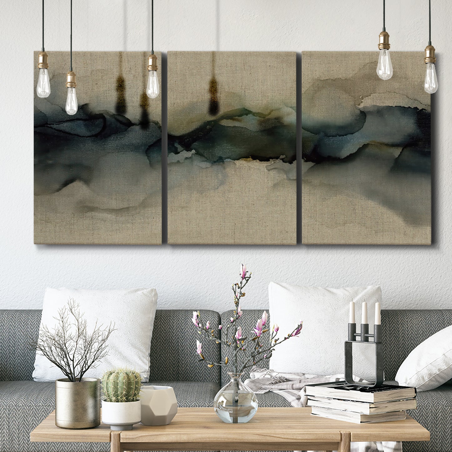 Three-panel canvas wall art featuring calm abstract water surface stillness, displayed in a modern living room above seating.