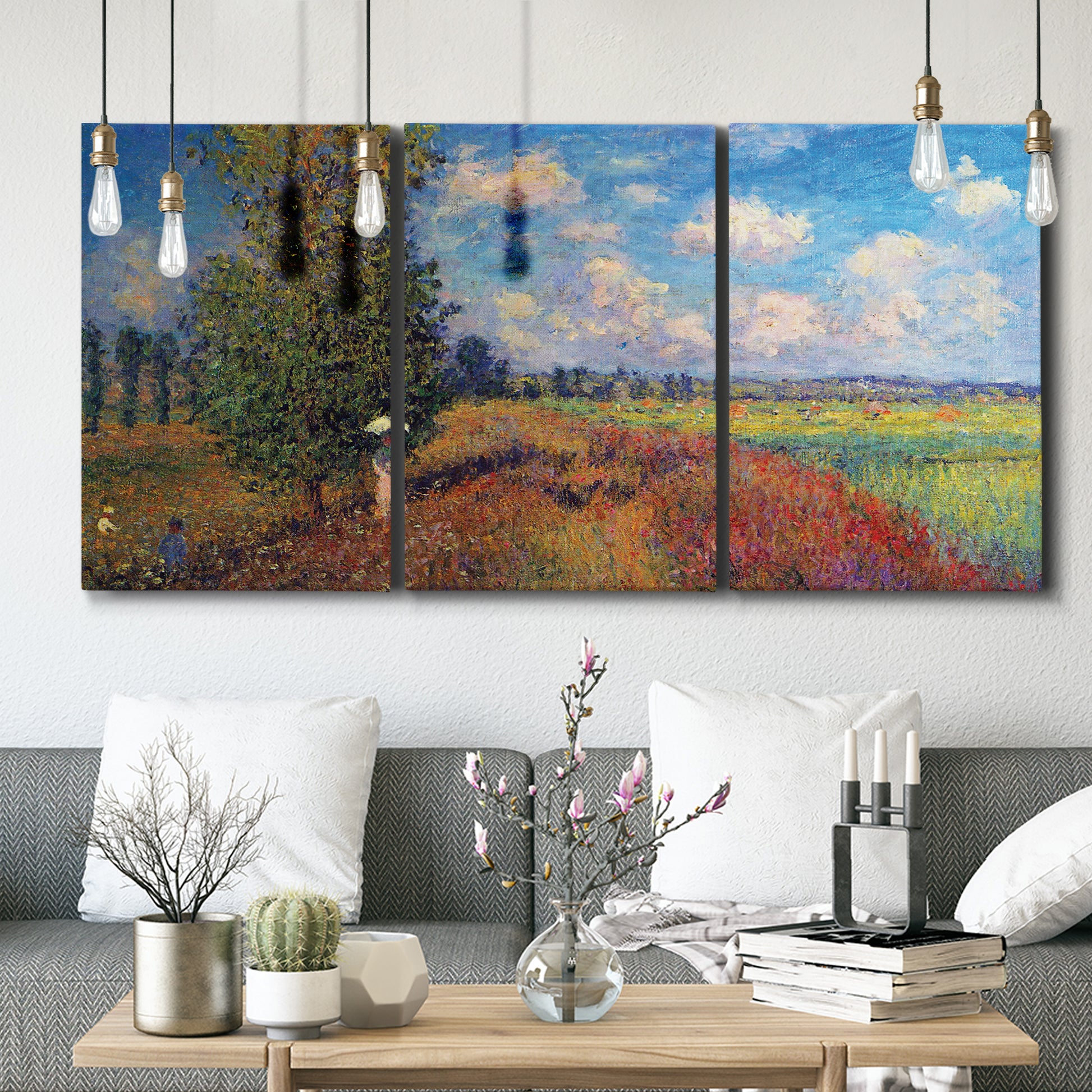 Three-panel canvas wall art featuring summer poppy field in bloom, displayed in a modern living room above seating.