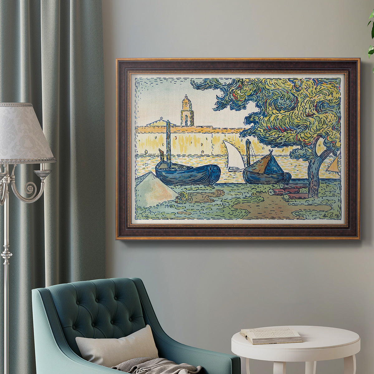 Impressionist harbor scene at Saint-Tropez by Paul Signac in an ornate bronzed mahogany wood frame displayed in a bright interior setting.