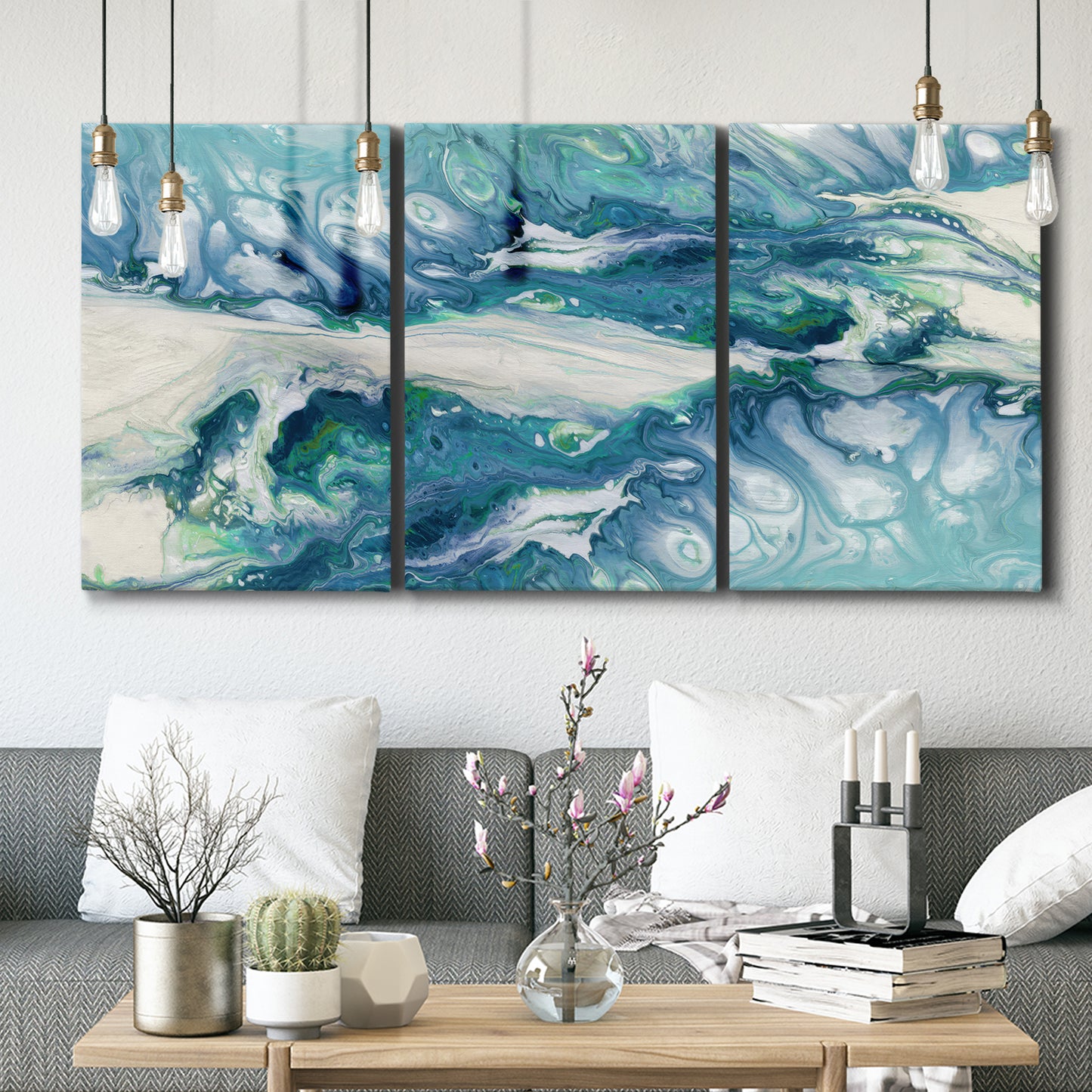 Three-panel canvas wall art featuring layered abstract marble textures, displayed in a modern living room above seating.