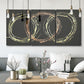 Three-panel canvas wall art featuring geometric abstract wave tangents, displayed in a modern living room above seating.