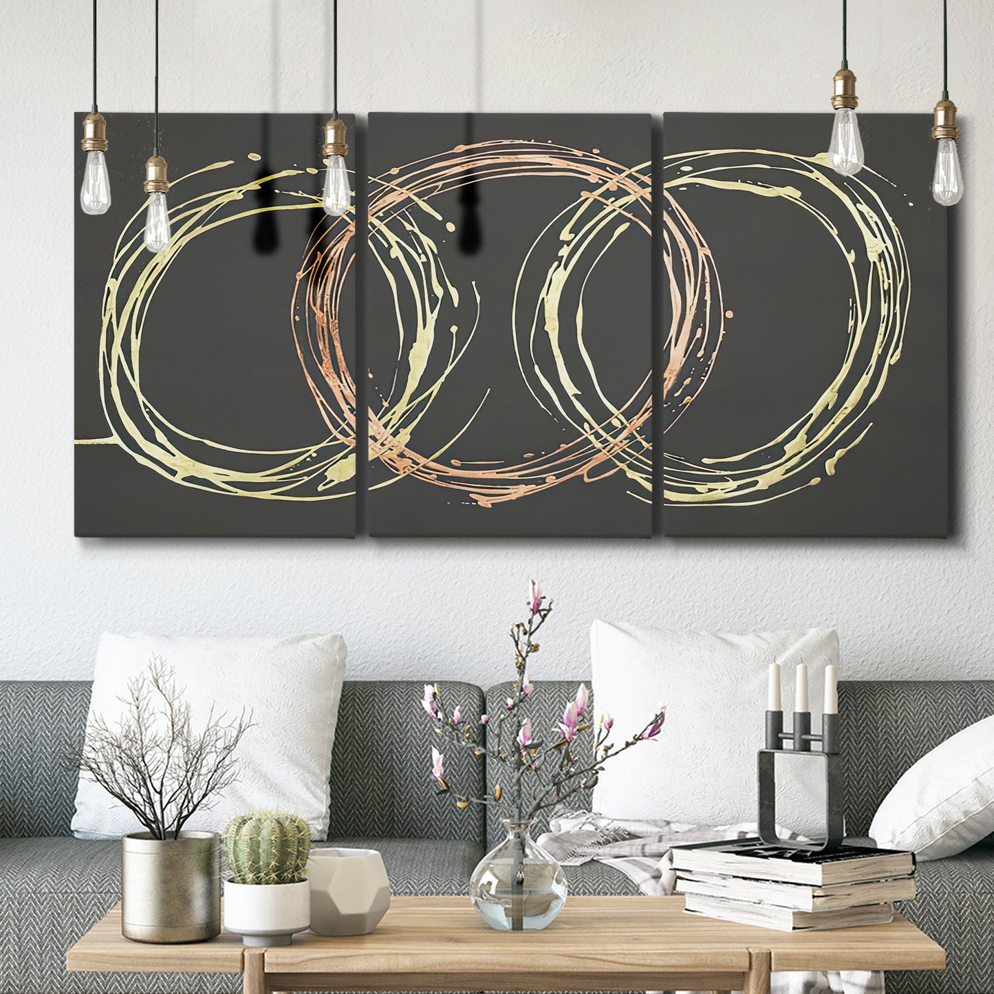 Three-panel canvas wall art featuring geometric abstract wave tangents, displayed in a modern living room above seating.