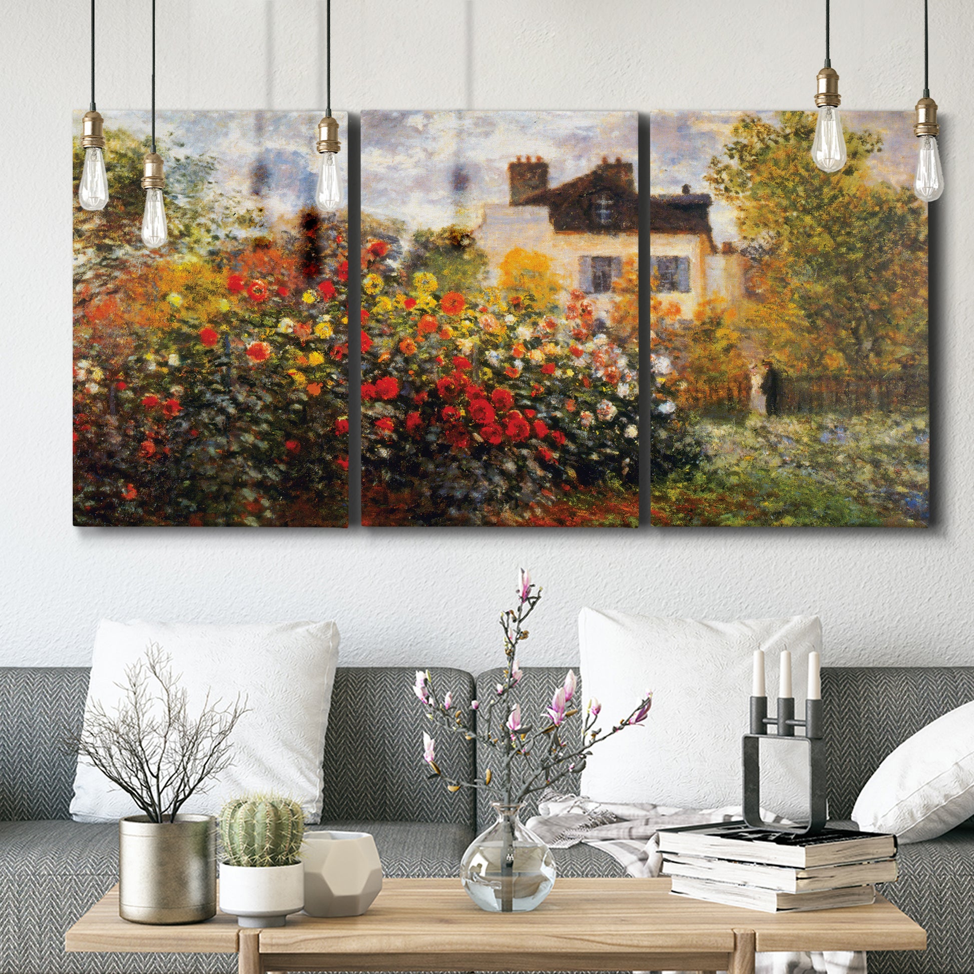Three-panel canvas wall art featuring farm buildings in rural normandy, displayed in a modern living room above seating.