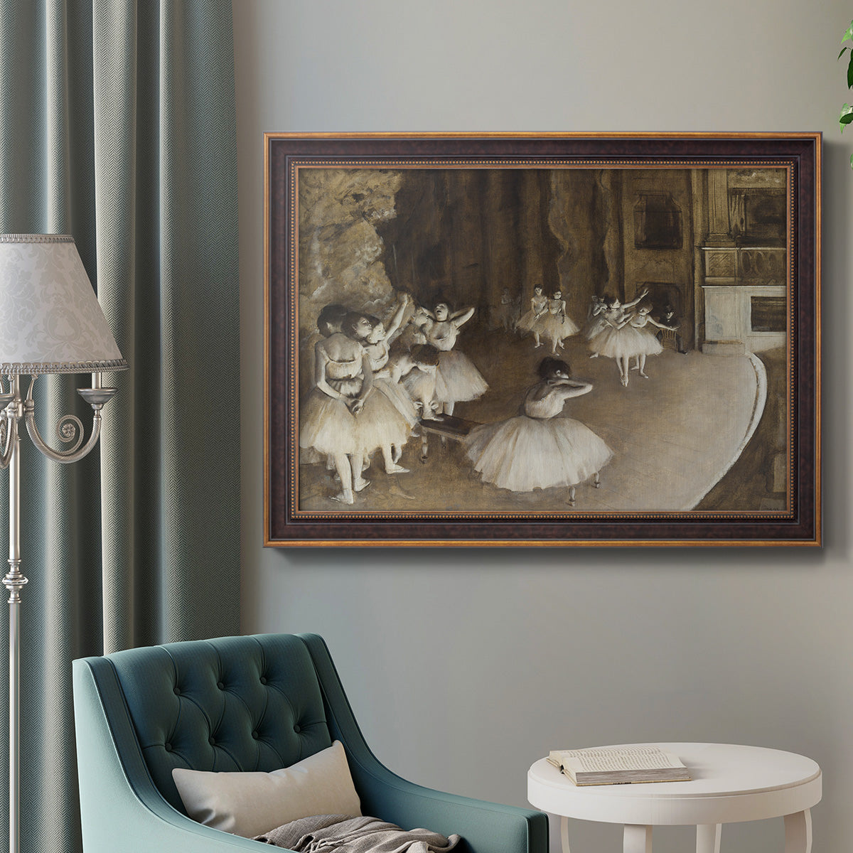 Impressionist ballet rehearsal scene by Edgar Degas in an ornate bronzed mahogany wood frame displayed in a bright interior setting.