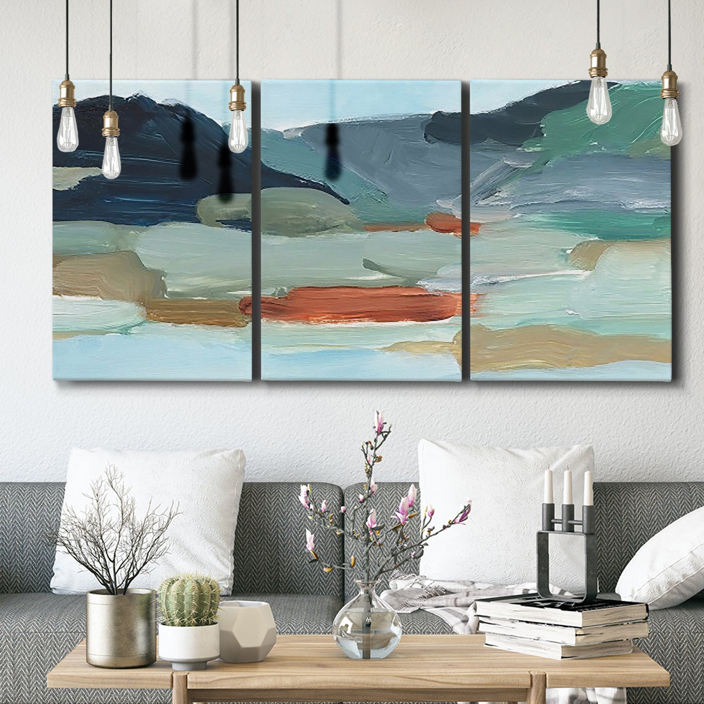 Three-panel canvas wall art featuring vibrant abstract with dramatic motion, displayed in a modern living room above seating.