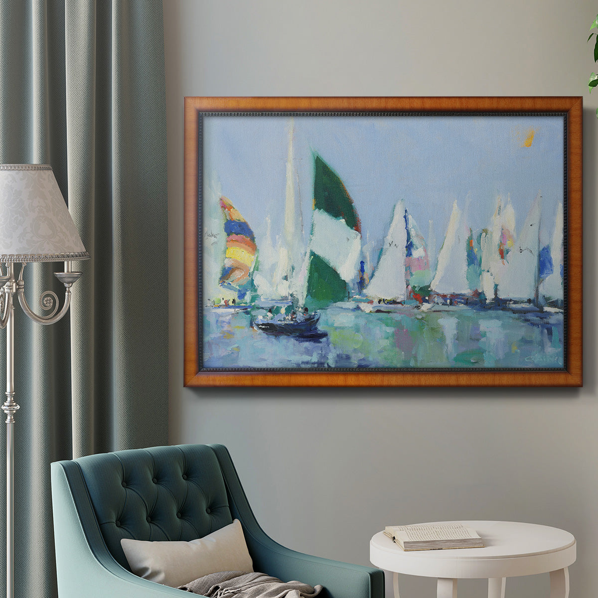 Coastal harbor watercolor painting in an ornate vintage burl wood frame displayed in a neutral interior setting.