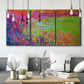 Three-panel canvas wall art featuring abstract meadow inspired color fields, displayed in a modern living room above seating.