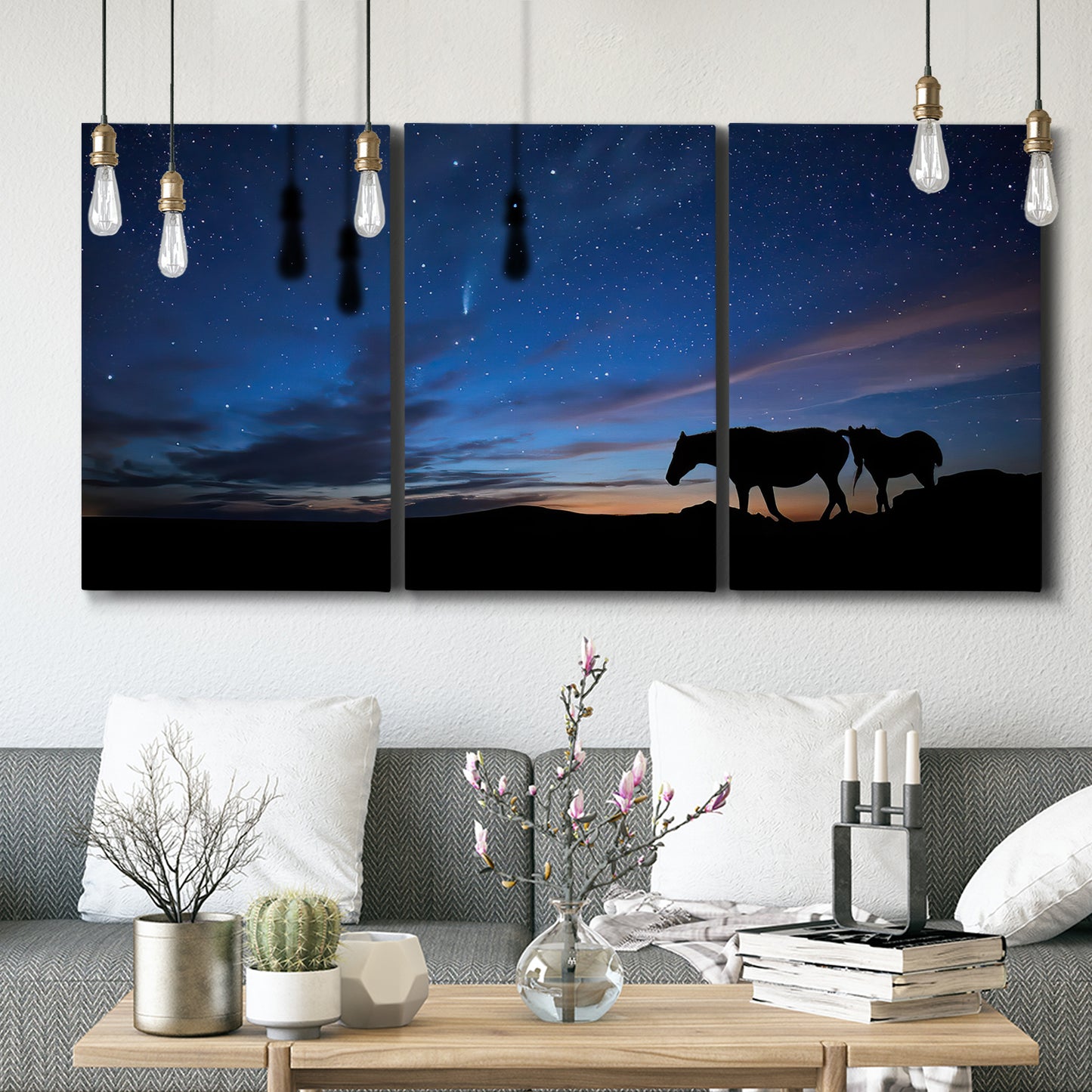 Three-panel canvas wall art featuring resting animals in open field, displayed in a modern living room above seating.