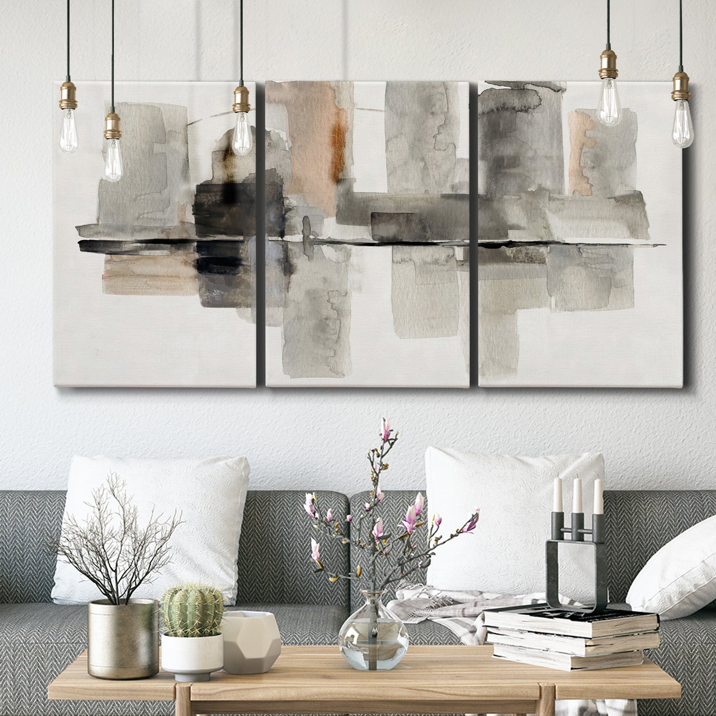 Three-panel canvas wall art featuring urban abstract watercolor oasis, displayed in a modern living room above seating.