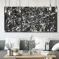 Three-panel canvas wall art featuring energetic expressionist abstract splatter, displayed in a modern living room above seating.