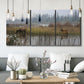 Three-panel canvas wall art featuring wildlife walking through open field, displayed in a modern living room above seating.