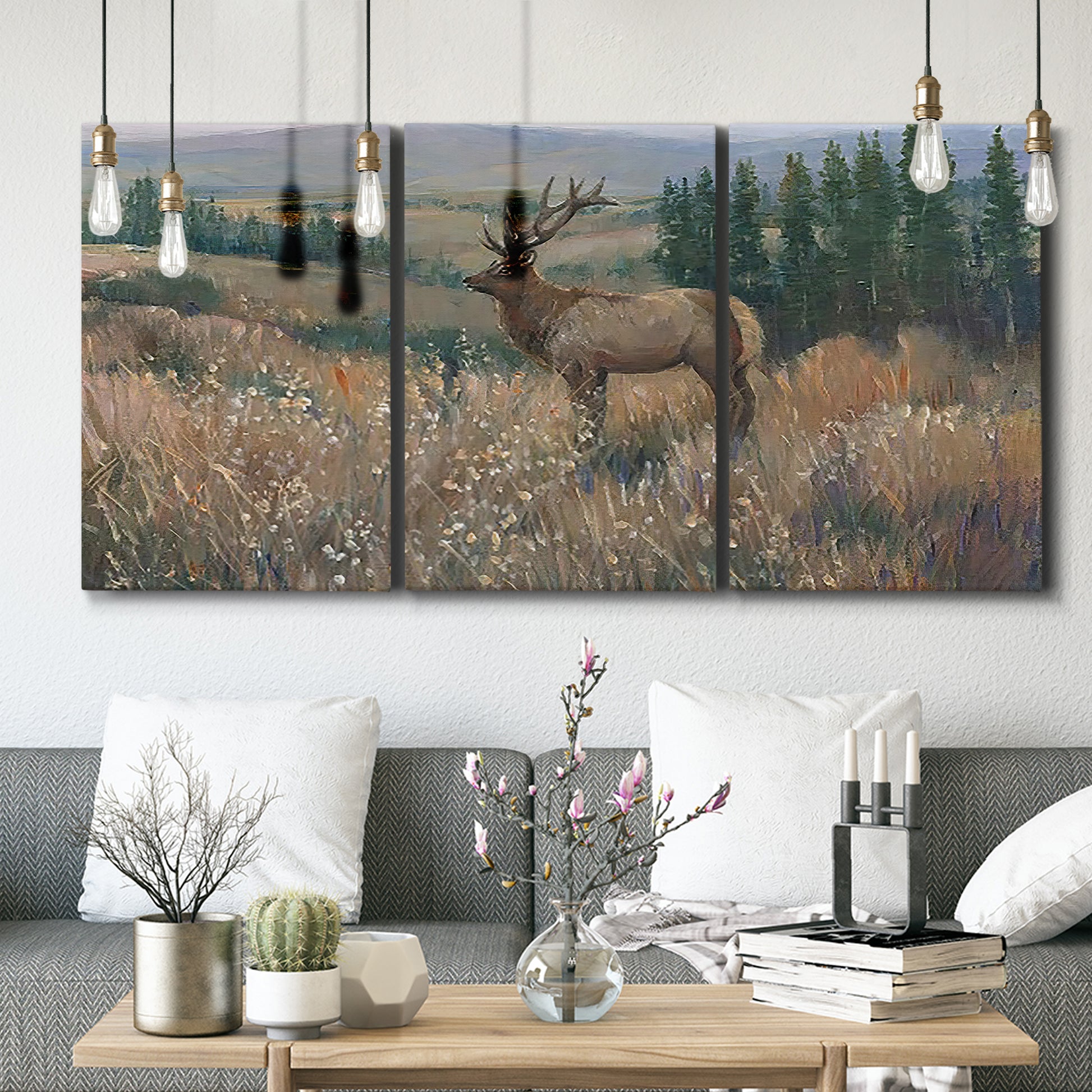 Three-panel canvas wall art featuring western wildlife standing in grassland, displayed in a modern living room above seating.