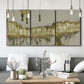 Three-panel canvas wall art featuring gold accented abstract ravine, displayed in a modern living room above seating.