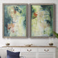 Set of two gray barnwood framed canvas prints depicting a coordinated art pair of layered blue green cream and charcoal textures rendered as nature-inspired mixed-media abstracts above a dining room sideboard.
