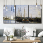 Three-panel canvas wall art featuring small pleasure boats on calm water, displayed in a modern living room above seating.