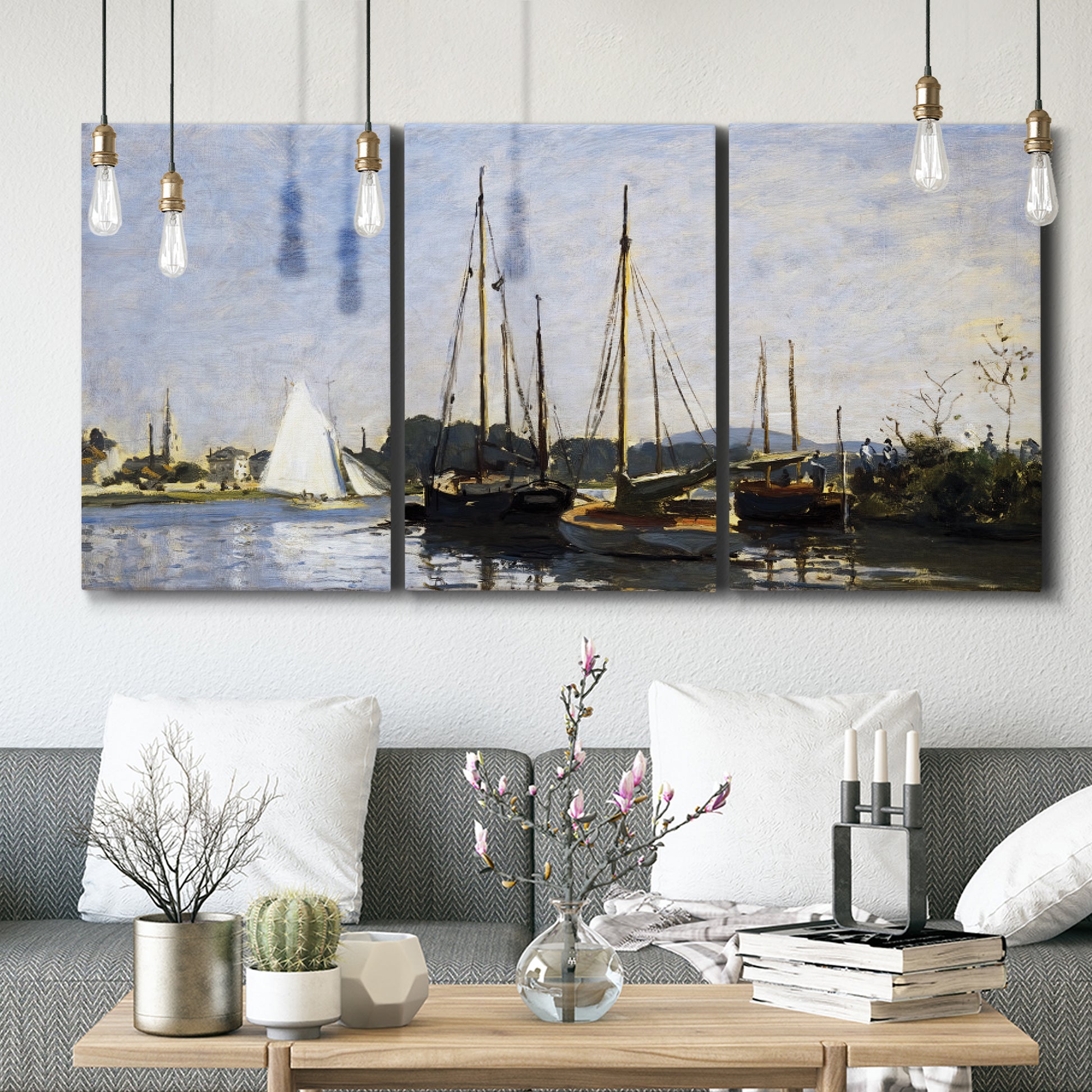 Three-panel canvas wall art featuring small pleasure boats on calm water, displayed in a modern living room above seating.