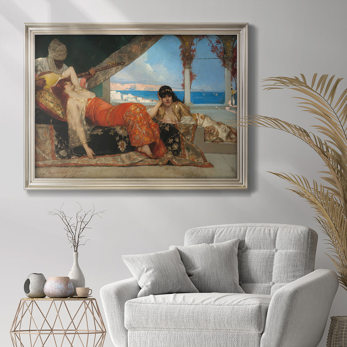 Orientalist portrait scene by Jean-Joseph Benjamin-Constant in an ornate champagne frame displayed in a bright interior setting.
