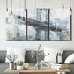 Three-panel canvas wall art featuring urban cityscape with architectural forms, displayed in a modern living room above seating.