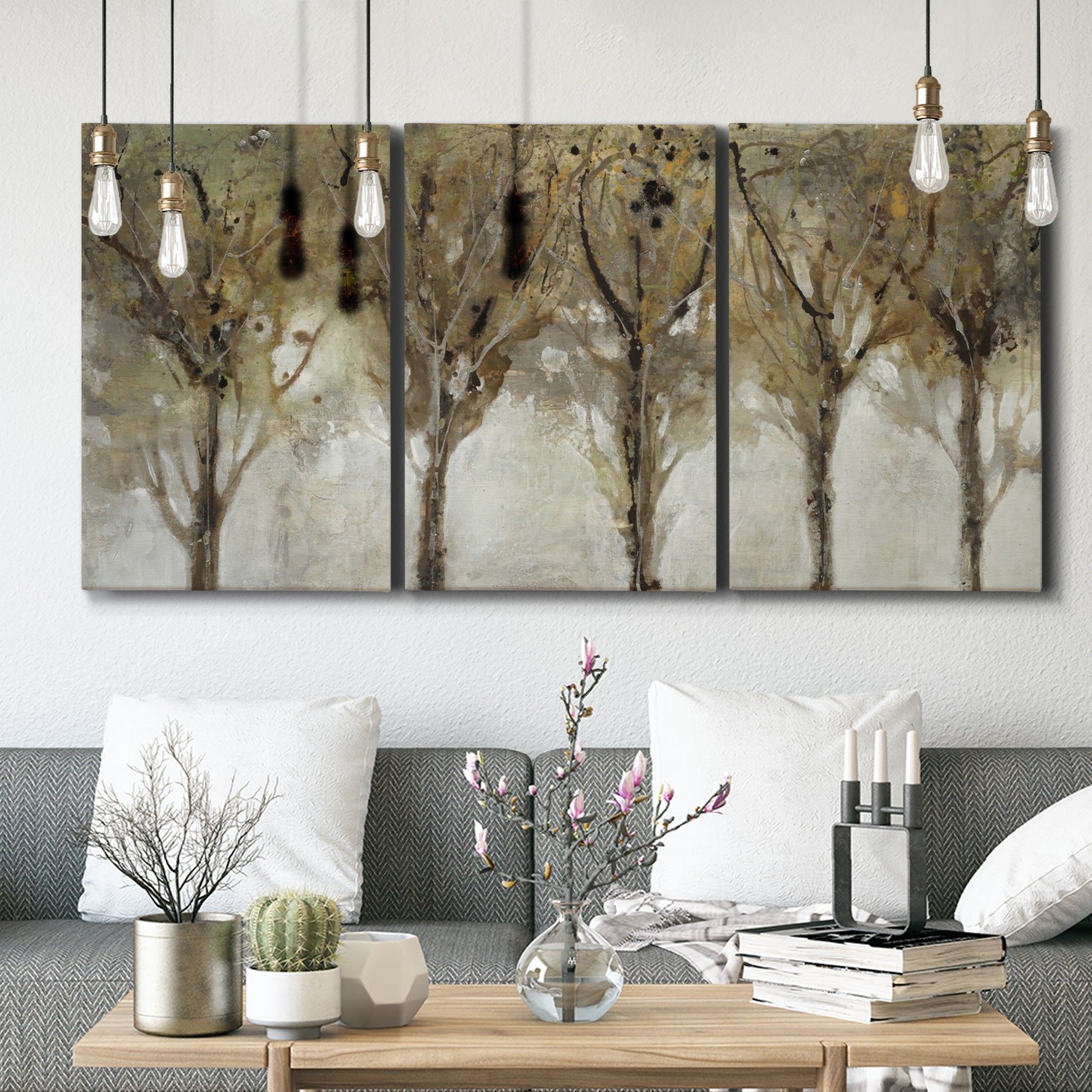 Three-panel canvas wall art featuring sunlight filtering through trees, displayed in a modern living room above seating.