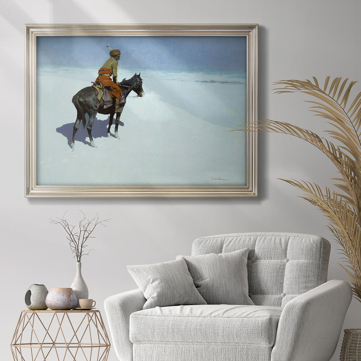 Impressionist western scout scene by Frederic Remington in an ornate champagne frame displayed in a bright interior setting.