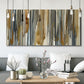 Three-panel canvas wall art featuring abstract vertical illusion pattern, displayed in a modern living room above seating.