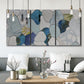 Three-panel canvas wall art featuring mid century geometric pink abstraction, displayed in a modern living room above seating.
