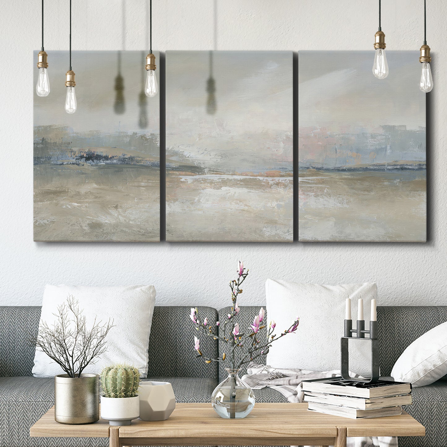 Three-panel canvas wall art featuring soft abstract horizon haze, displayed in a modern living room above seating.