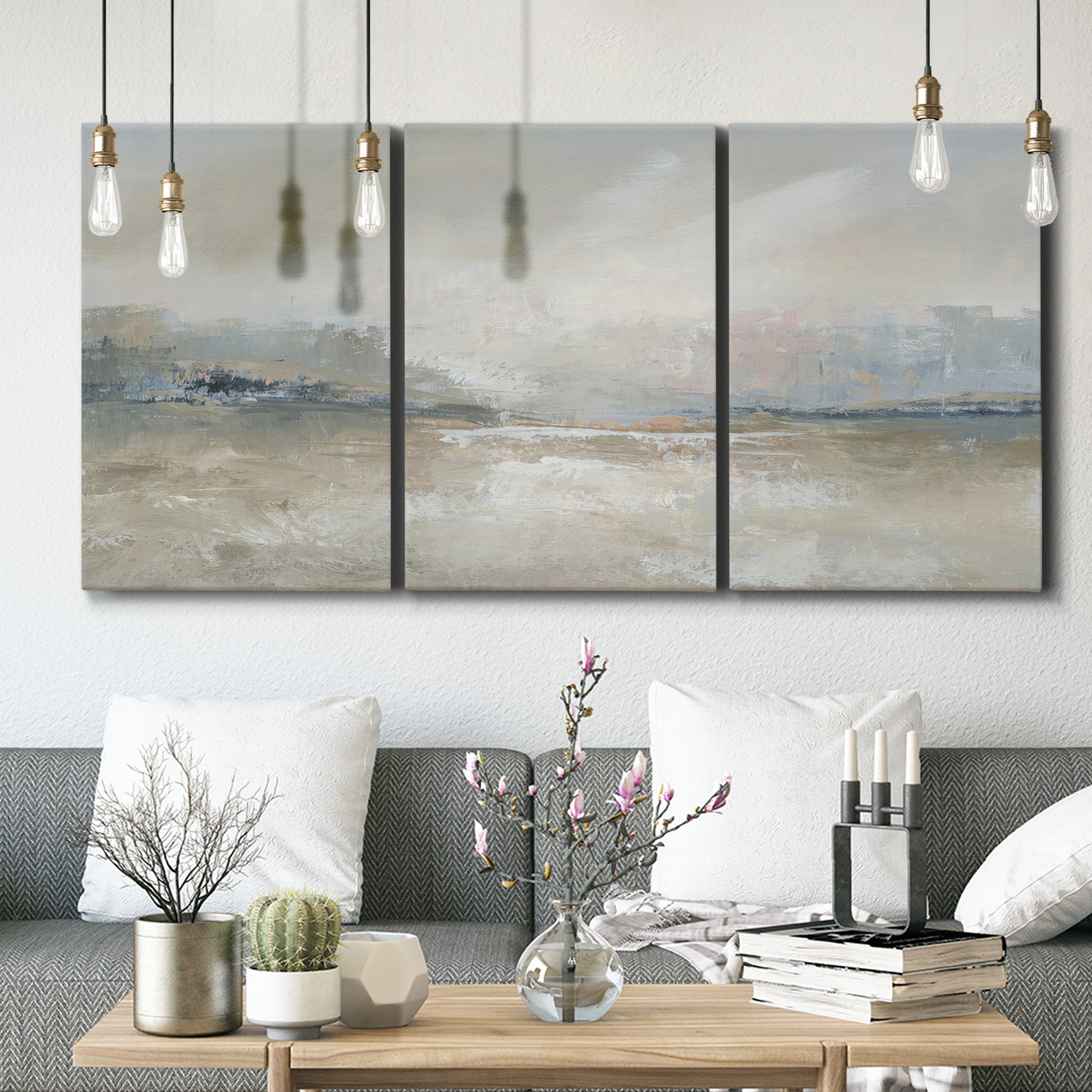 Three-panel canvas wall art featuring soft abstract horizon haze, displayed in a modern living room above seating.