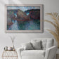 Impressionist rocky seascape by Claude Monet in an ornate weathered white frame displayed in a bright interior setting.