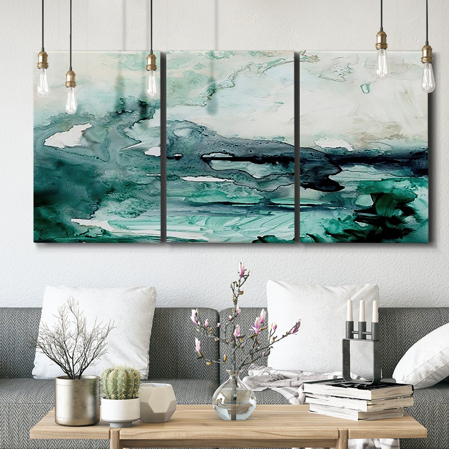 Three-panel canvas wall art featuring coastal abstract sea foam movement, displayed in a modern living room above seating.