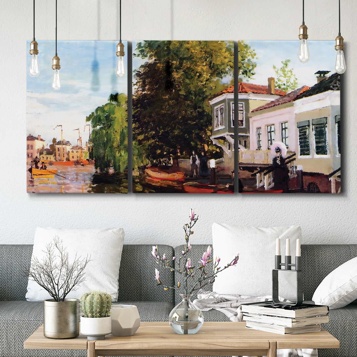 Three-panel canvas wall art featuring riverside houses along canal, displayed in a modern living room above seating.