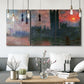 Three-panel canvas wall art featuring parliament silhouetted at dusk, displayed in a modern living room above seating.