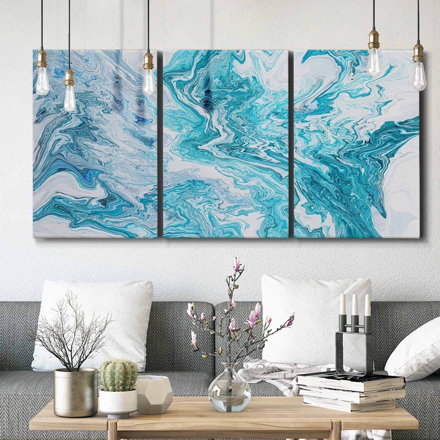 Three-panel canvas wall art featuring rocky coastal tide pool scene, displayed in a modern living room above seating.