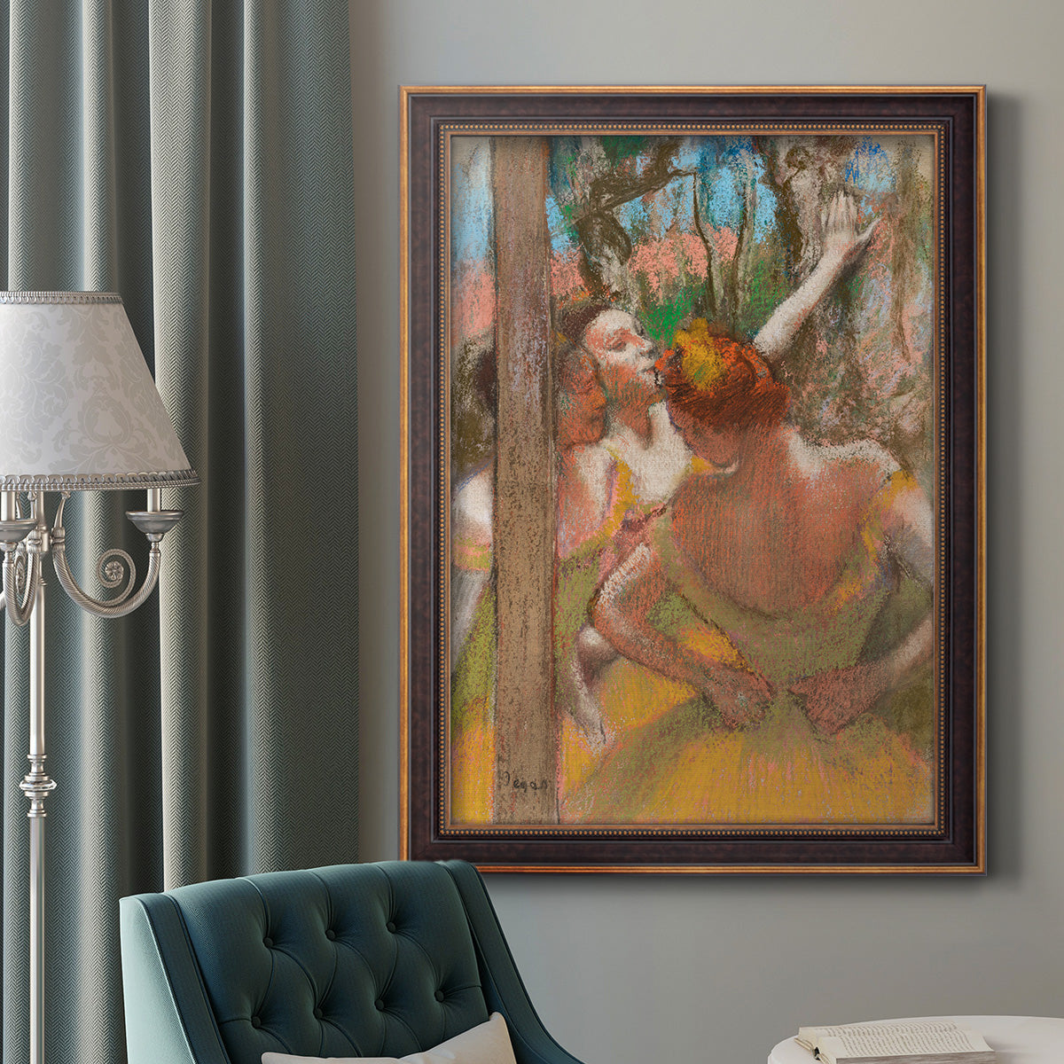 Impressionist ballet dancer composition by Edgar Degas in an ornate bronzed mahogany wood frame displayed in a dark-toned interior setting.