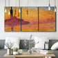 Three-panel canvas wall art featuring venetian church at twilight, displayed in a modern living room above seating.