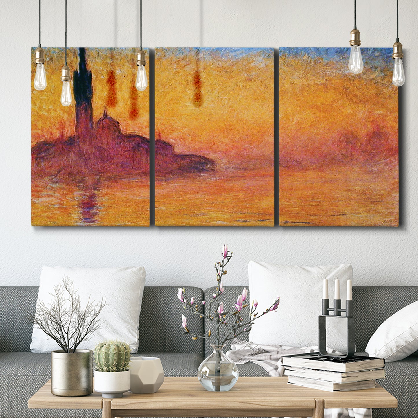 Three-panel canvas wall art featuring venetian church at twilight, displayed in a modern living room above seating.