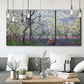 Three-panel canvas wall art featuring fresh spring countryside landscape, displayed in a modern living room above seating.