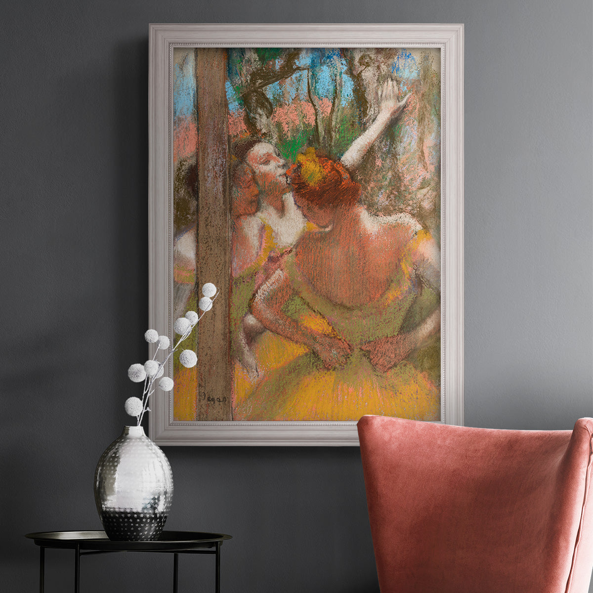 Impressionist ballet dancer composition by Edgar Degas in an ornate weathered white frame displayed in a dark-toned interior setting.