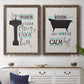 Set of two walnut barnwood framed canvas prints depicting a coordinated art pair of playful bathtub silhouettes and bath-themed typography rendered as graphic bathroom word art above a dining room sideboard.