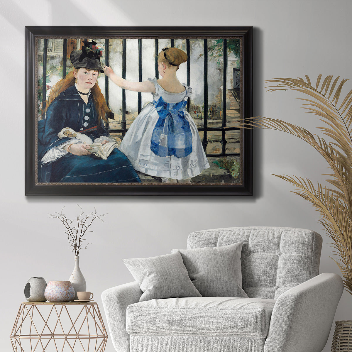 Impressionist urban scene near a railway by Édouard Manet in an ornate black frame with gilded inner detail displayed in a bright interior setting.
