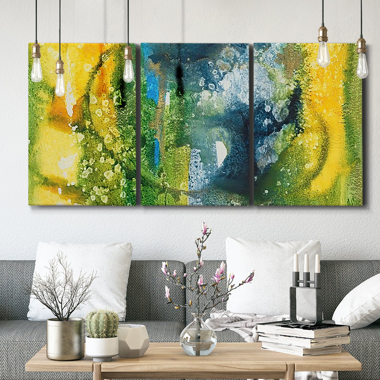 Three-panel canvas wall art featuring energetic abstract aquatic color motion, displayed in a modern living room above seating.