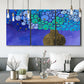 Three-panel canvas wall art featuring blue poppy floral abstraction, displayed in a modern living room above seating.